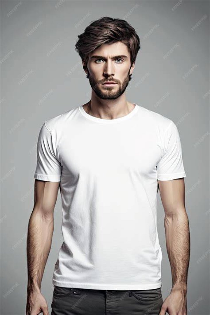 a man wearing a white shirt and black pants is straightening his tie