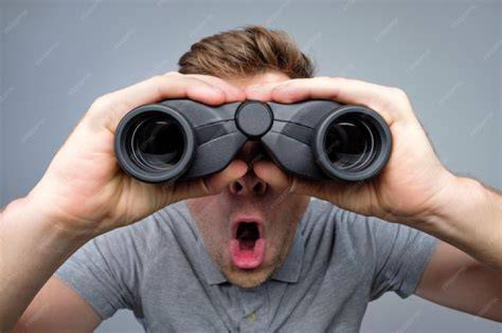 a person is looking through a scope at something in the distance that