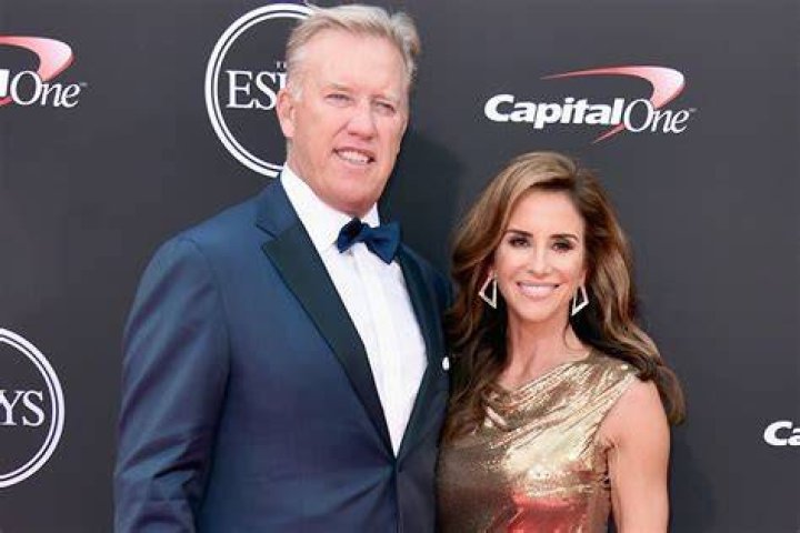 John Elway and his wife Paige at the Flight to Luxury Hangar Event 2012 Fashion, Coat, Lab coat