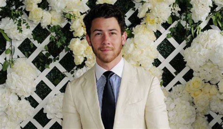 Nick Jonas Revamps Linen with Brown Leather Boots at Wimbledon 2023 Footwear News