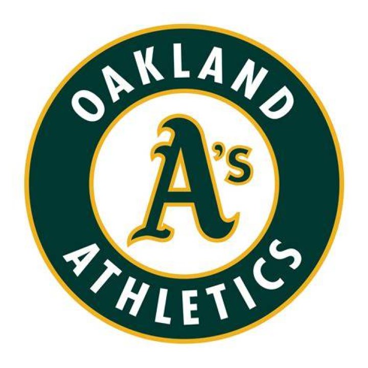 Oakland Athletics' Mark Kotsay and supermodel Monika Schnarre chat with